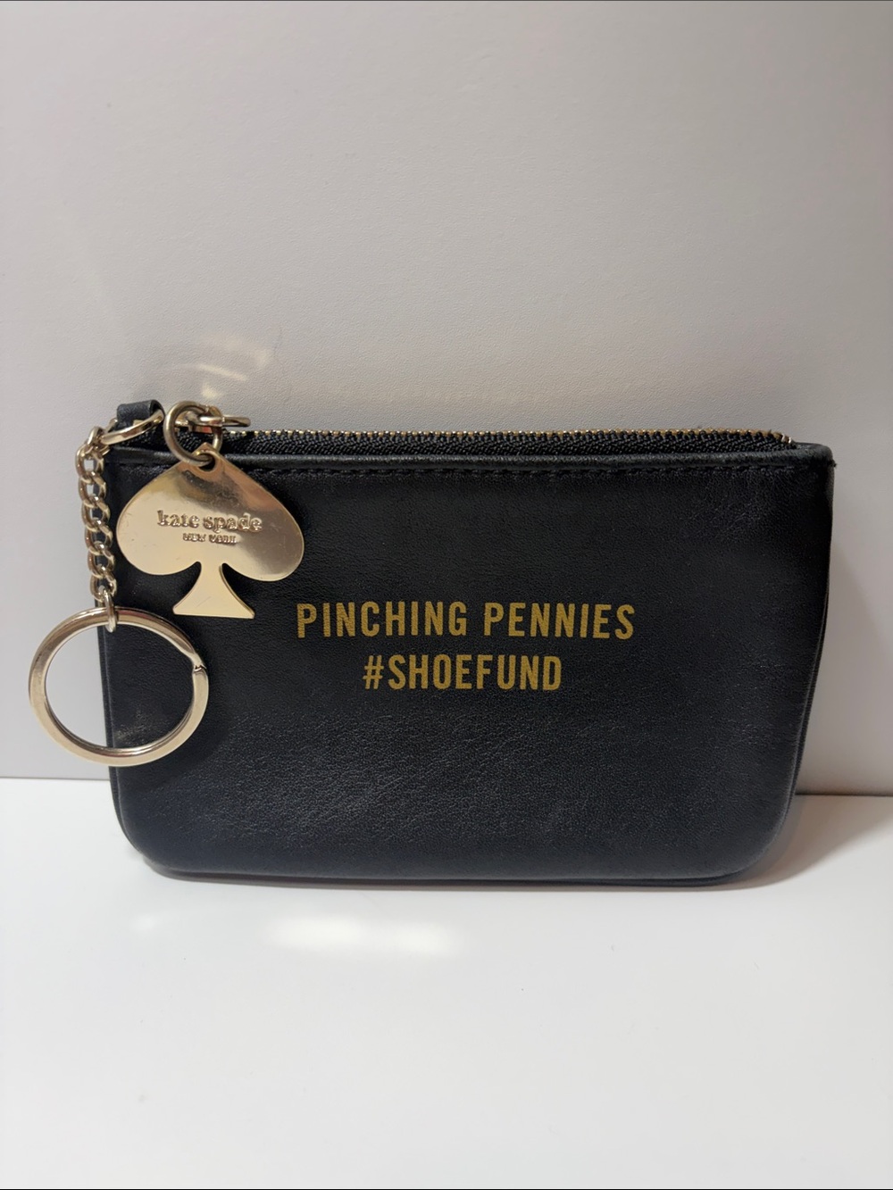 Kate Spade "shoefund" black coin pouch with gold logo charm and keychain